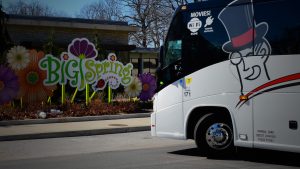 Barons Bus parked in front of Big Spring sign