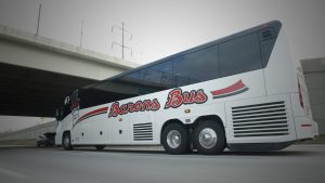 Barons Bus driving under overpass with low angle