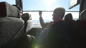 barons bus our fleet interior passenger pulling window shade